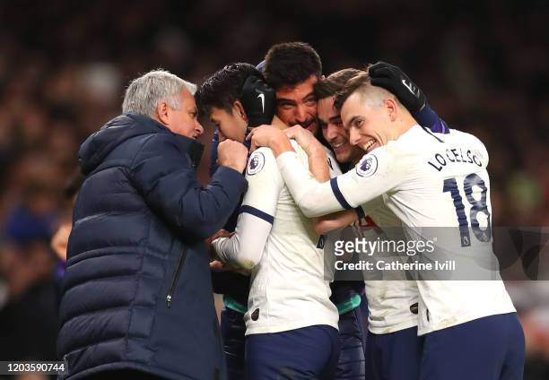Heung-Min Son of Tottenham Hotspur celebrates with teammates and Jose Mourinho, Manager of Tottenham Hotspur after scoring his team's second goal...