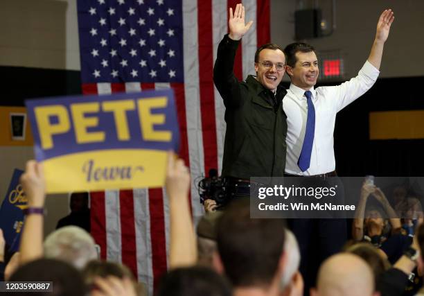 Democratic presidential candidate former South Bend, Indiana Mayor Pete Buttigieg and his husband Chasten wave to supporters after the candidate...