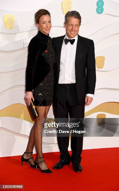 Anna Eberstein and Hugh Grant attend the EE British Academy Film Awards 2020 at Royal Albert Hall on February 02, 2020 in London, England.