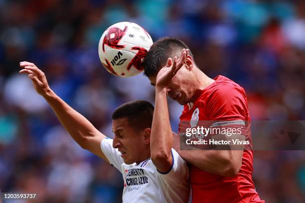 Roberto Alvarado of Cruz Azul struggles for the ball against Javier Guemez of Toluca during the 4th round match between Toluca and Cruz Azul as part...