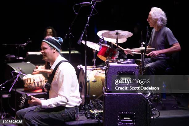 Bass player Krist Novoselic of Nirvana and Drummer John Densmore, founding member of The Doors, perform onstage during Homeward Bound: A Benefit for...