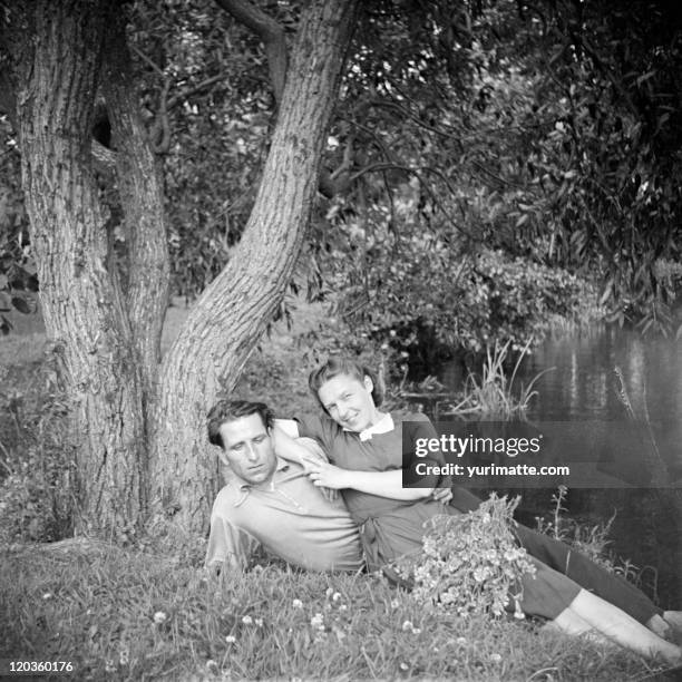 laying on grass - 1950s couple stock pictures, royalty-free photos & images