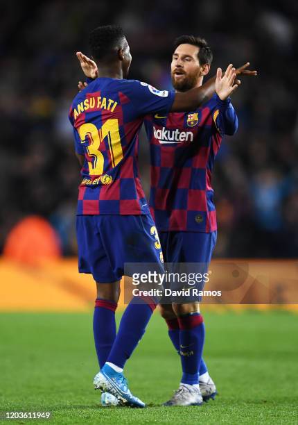 Ansu Fati of FC Barcelona celebrates with Lionel Messi of FC Barcelona his sides first goal during the Liga match between FC Barcelona and Levante UD...