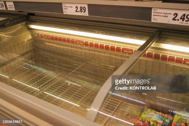 An empty fridge counter in a supermarkets stormed by the Romanian population frightened by the coronavirus present in Italy and worried by the many...