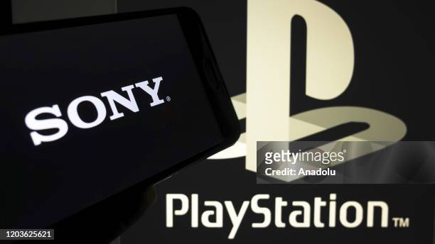 In this photo illustration a mobile phone and a computer screen display the PlayStation and Sony logo in Ankara Turkey on February 27, 2020. Fatih...