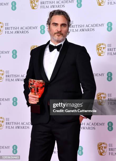 Joaquin Phoenix with his Best Actor award for "The Joker' poses in the Winners Room during the EE British Academy Film Awards 2020 at Royal Albert...