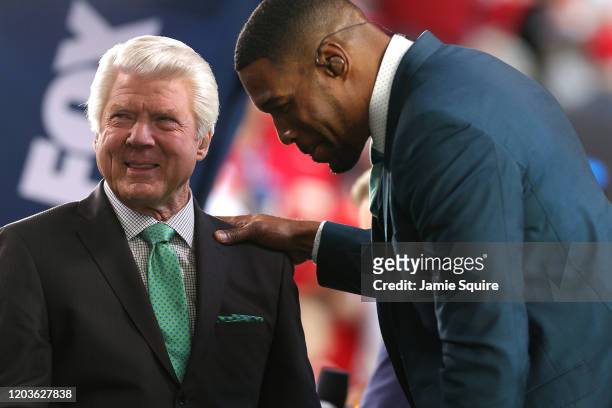 Former NFL head coach and Fox Sports analyst Jimmy Johnson talks with former NFL player and Fox Sports analyst Michael Strahan prior to Super Bowl...