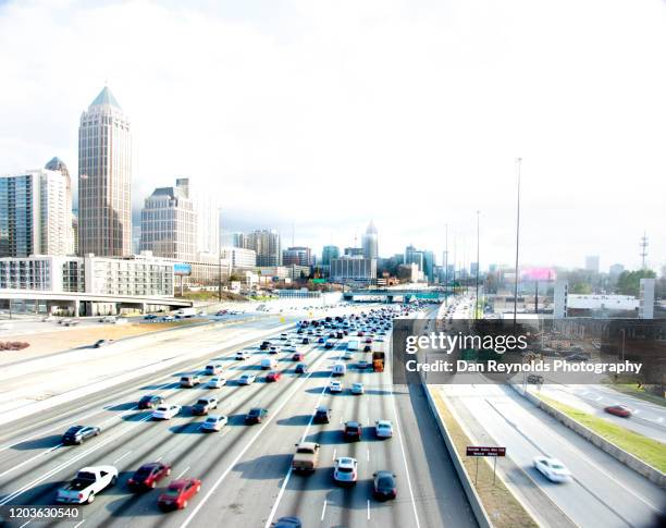 atlanta, georgia against white sky - atlanta traffic stock pictures, royalty-free photos & images