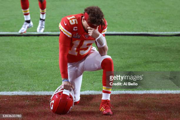 Patrick Mahomes of the Kansas City Chiefs kneels before Super Bowl LIV against the San Francisco 49ers at Hard Rock Stadium on February 02, 2020 in...