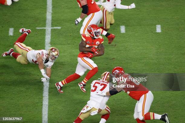 Damien Williams of the Kansas City Chiefs runs with the ball against the San Francisco 49ers during the first quarter in Super Bowl LIV at Hard Rock...