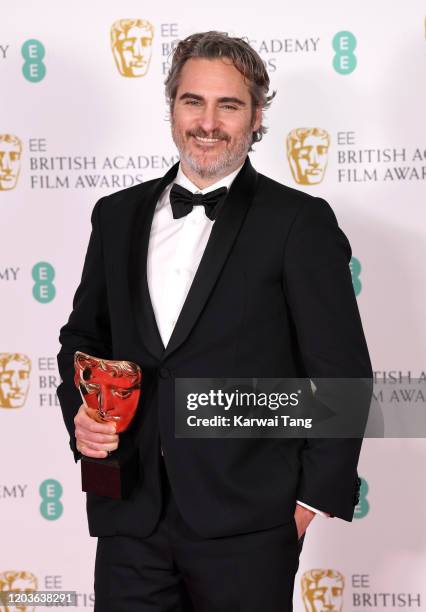 Joaquin Phoenix with his Best Actor award for "The Joker' poses in the Winners Room during the EE British Academy Film Awards 2020 at Royal Albert...