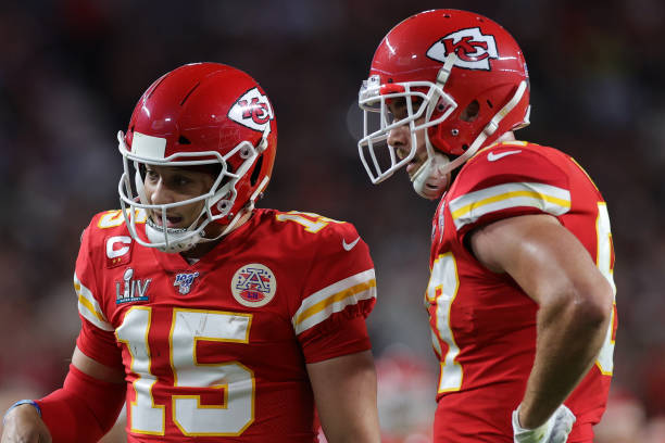 Patrick Mahomes and Travis Kelce of the Kansas City Chiefs talk against the San Francisco 49ers during the first quarter in Super Bowl LIV at Hard...