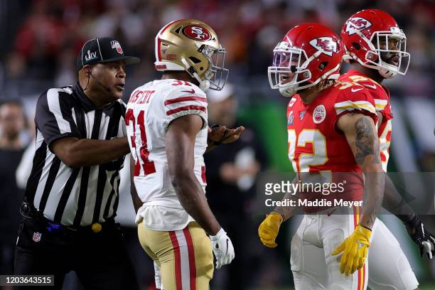Raheem Mostert of the San Francisco 49ers reacts against Tyrann Mathieu of the Kansas City Chiefs during the second quarter in Super Bowl LIV at Hard...