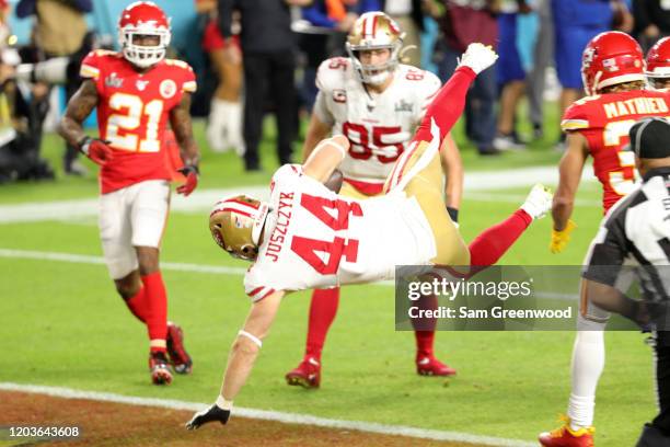 Kyle Juszczyk of the San Francisco 49ers scores a 15-yard touchdown in the second quarter of Super Bowl LIV against the Kansas City Chiefs at Hard...