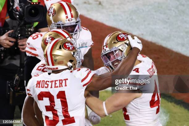 Kyle Juszczyk of the San Francisco 49ers reacts after a 15-yard touchdown reception against the Kansas City Chiefs during the second quarter in Super...