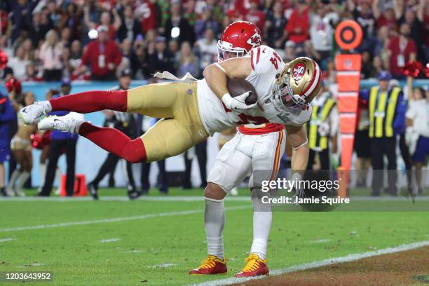 Kyle Juszczyk of the San Francisco 49ers scores on a 15-yard touchdown reception in the second quarter of Super Bowl LIV against the Kansas City...