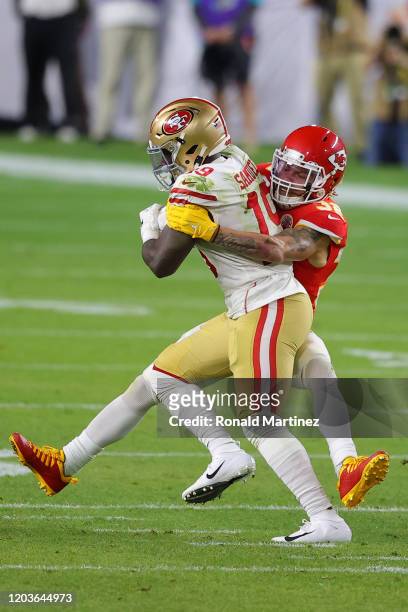 Deebo Samuel of the San Francisco 49ers is tackled by Tyrann Mathieu of the Kansas City Chiefs during the second quarter in Super Bowl LIV at Hard...