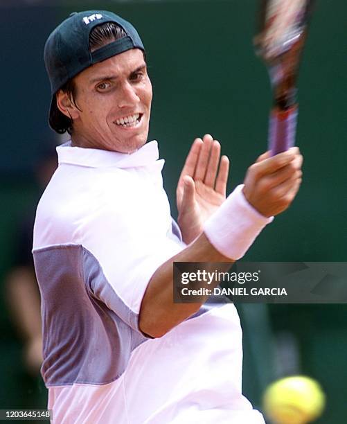 Tennis player Juan Chela is seen in action 10 February 2002 in Buenos Aires, Argentina. El tenista argentino Juan Chela devuelve la pelota el 10 de...