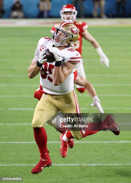 George Kittle of the San Francisco 49ers makes a reception against the Kansas City Chiefs during the second quarter in Super Bowl LIV at Hard Rock...