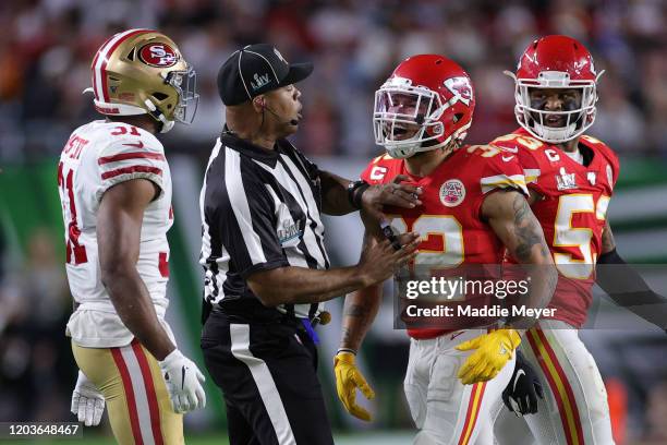 Raheem Mostert of the San Francisco 49ers reacts against Tyrann Mathieu of the Kansas City Chiefs during the second quarter in Super Bowl LIV at Hard...