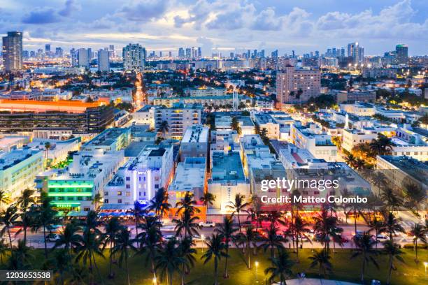 aerial of ocean drive and miami downtown at dusk, florida - ocean drive stockfoto's en -beelden