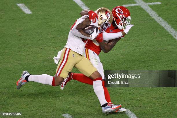 Kendrick Bourne of the San Francisco 49ers is tackled by Charvarius Ward of the Kansas City Chiefs during the third quarter in Super Bowl LIV at Hard...