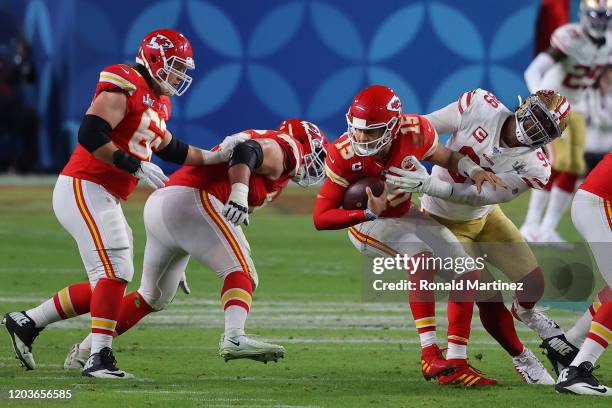 Patrick Mahomes of the Kansas City Chiefs is sacked by DeForest Buckner of the San Francisco 49ers during the third quarter in Super Bowl LIV at Hard...