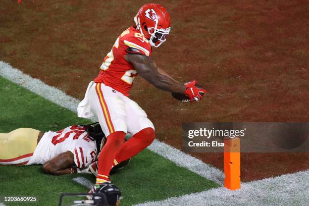 Damien Williams of the Kansas City Chiefs dives into the endzone for a touchdown against the San Francisco 49ers during the fourth quarter in Super...