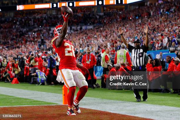 Damien Williams of the Kansas City Chiefs runs for a touchdown against the San Francisco 49ers during the fourth quarter in Super Bowl LIV at Hard...