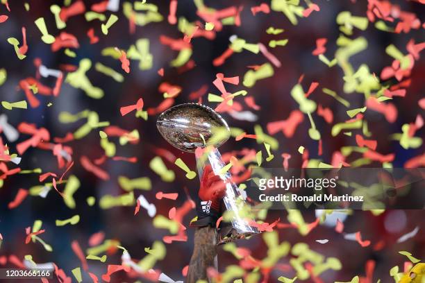 The Kansas City Chiefs celebrate with the Vince Lombardi Trophy after defeating the San Francisco 49ers 31-20 in Super Bowl LIV at Hard Rock Stadium...