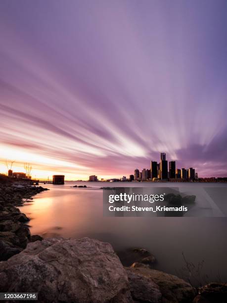detroit, michigan - winter skyline at dusk - detroit michigan night stock pictures, royalty-free photos & images