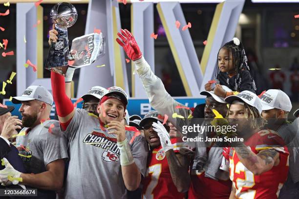 Patrick Mahomes of the Kansas City Chiefs raises the Vince Lombardi Trophy after defeating the San Francisco 49ers 31-20 in Super Bowl LIV at Hard...