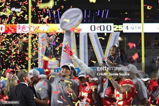 Patrick Mahomes of the Kansas City Chiefs raises the Vince Lombardi Trophy after defeating the San Francisco 49ers 31-20 in Super Bowl LIV at Hard...
