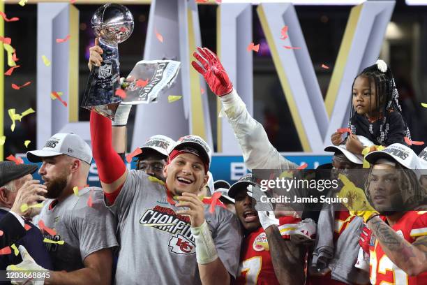 Patrick Mahomes of the Kansas City Chiefs raises the Vince Lombardi Trophy after defeating the San Francisco 49ers 31-20 in Super Bowl LIV at Hard...