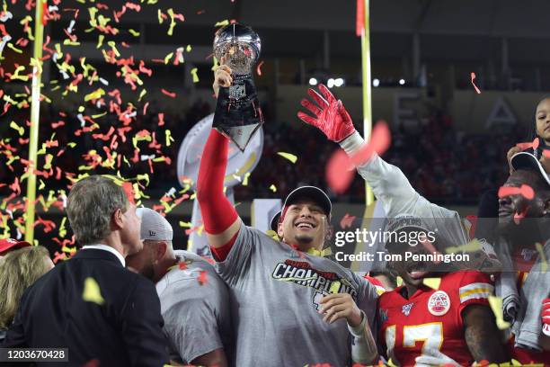 Patrick Mahomes of the Kansas City Chiefs raises the Vince Lombardi Trophy after defeating the San Francisco 49ers 31-20 in Super Bowl LIV at Hard...