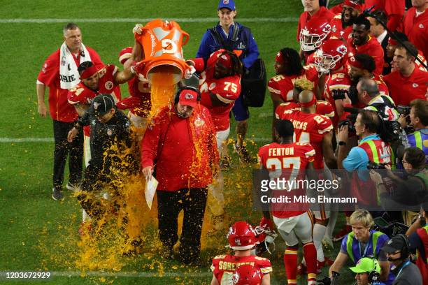 Head coach Andy Reid of the Kansas City Chiefs gets a ice bath after defeating the San Francisco 49ers 31-20 in Super Bowl LIV at Hard Rock Stadium...