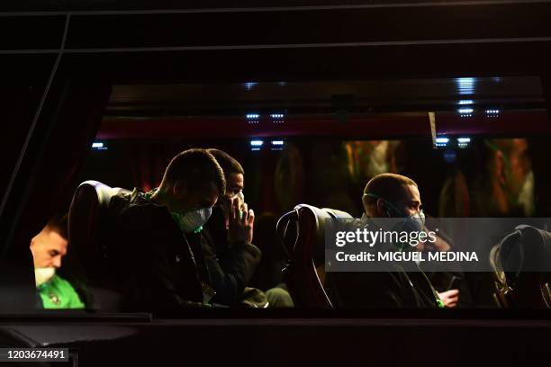 Players of Ludogorets wear protective face masks as a safety measure against the COVID-19, the novel coronavirus, as they sit in a bus on their way...