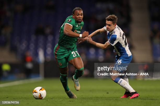 Adama Traore of Wolverhampton Wanderers and Pol Lozano of Espanyol during the UEFA Europa League round of 32 second leg match between Espanyol...