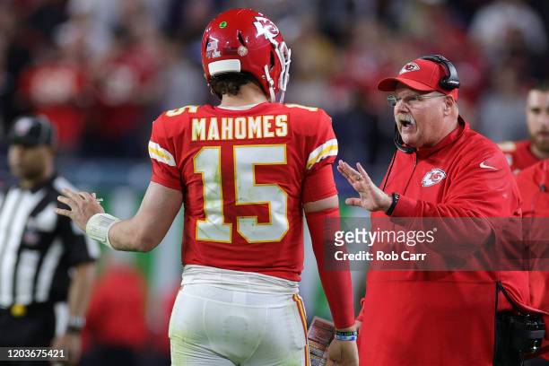 Head coach Andy Reid talks to Patrick Mahomes of the Kansas City Chiefs during the fourth quarter in Super Bowl LIV at Hard Rock Stadium on February...
