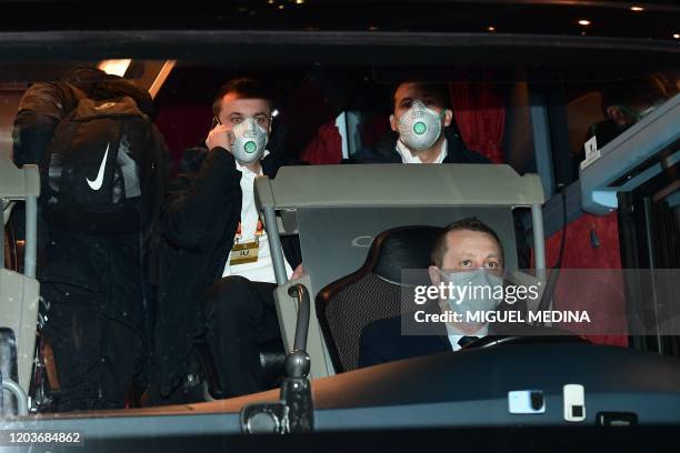 Players of Ludogorets wear protective face masks as a safety measure against the COVID-19, the novel coronavirus, as they sit in a bus on their way...