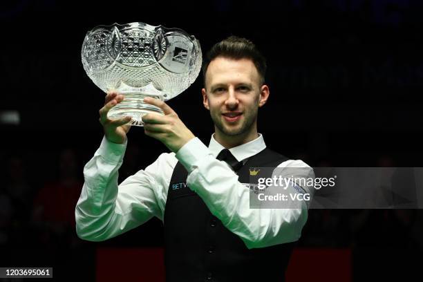 Judd Trump of England celebrates with his trophy after winning the final against Neil Robertson of Australia on day five of the German Masters 2020...