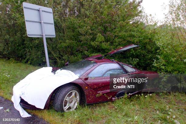 The McLaren F1 supercar of actor Rowan Atkinson is removed from the scene following a crash, August 4, 2011 in Peterborough, England. Atkinson pulled...