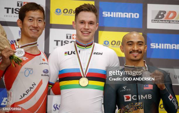 Second placed Japan's Yuta Wakimoto, winner Netherlands' Harrie Lavreysen and third placed Malaysia's Mohd Azizulhasni Awang pose on the podium after...