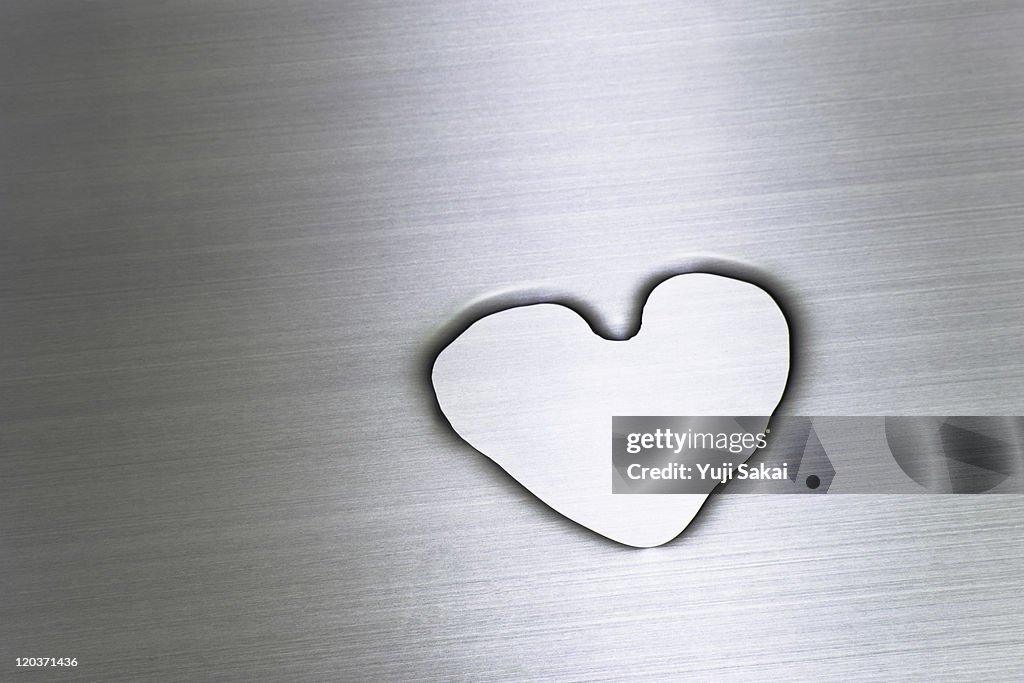 Water drawing hart on metal  board