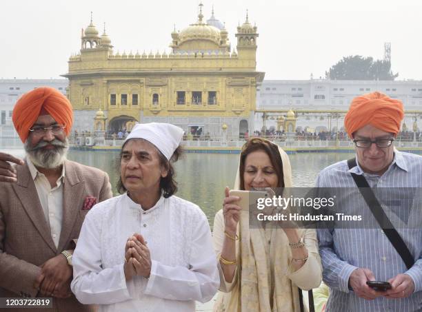 Indian tabla player and composer Zakir Hussain with his wife Antonia Minnecola during a visit to the Golden Temple on February 27, 2020 in Amritsar,...