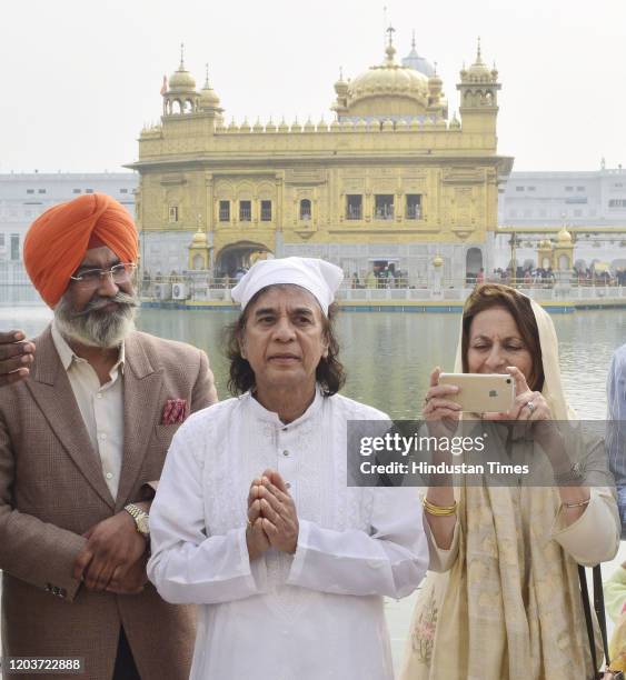 Indian tabla player and composer Zakir Hussain with his wife Antonia Minnecola during a visit to the Golden Temple on February 27, 2020 in Amritsar,...