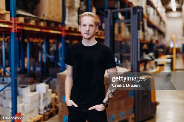 employee in warehouse, driving forklift - scandinavian descent stock pictures, royalty-free photos & images
