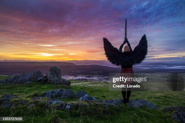 black winged warrior angel al amanecer - scottish traditional costume fotografías e imágenes de stock