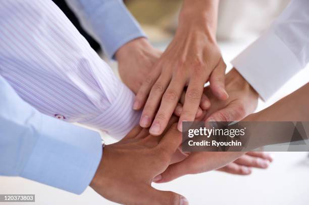 business,businesslife,office - team hands in huddle stock pictures, royalty-free photos & images