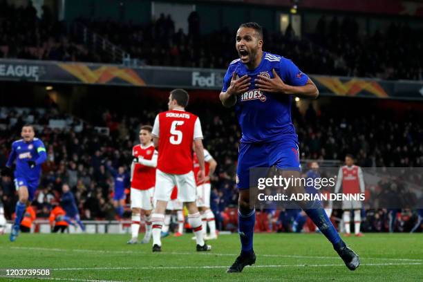 Olympiakos' French-born Moroccan striker Youssef El-Arabi celebrates after scoring their late goal in extra time during the UEFA Europa league round...